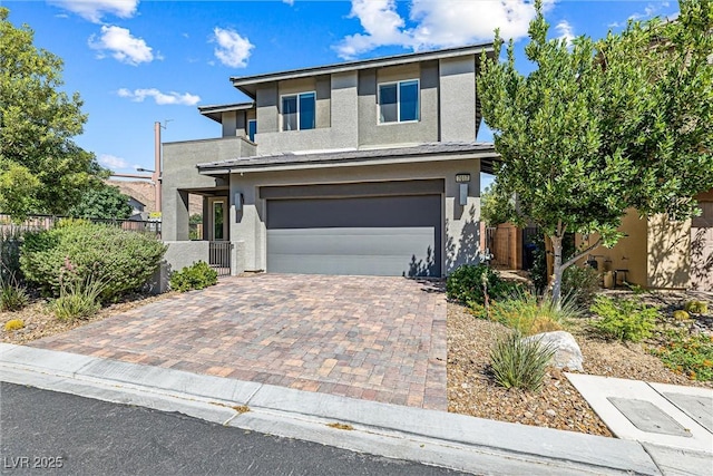 7017 Pearl Hilltop Ct, Las Vegas, NV 89148 - view of front of house featuring stucco siding, an attached garage, and decorative driveway