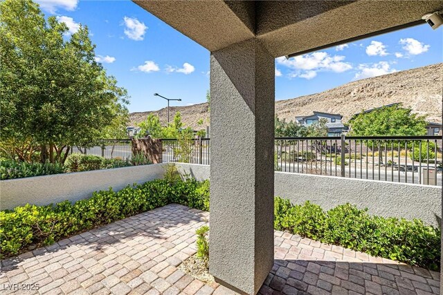 7017 Pearl Hilltop Ct, Las Vegas, NV 89148 - fenced backyard featuring a mountain view and a patio