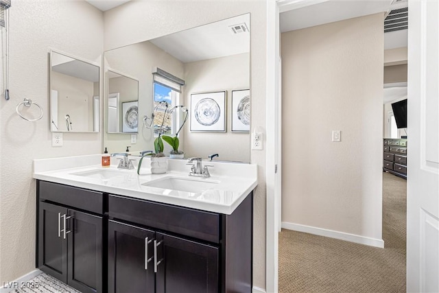 7017 Pearl Hilltop Ct, Las Vegas, NV 89148 - bathroom with double vanity and baseboards