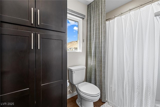 7017 Pearl Hilltop Ct, Las Vegas, NV 89148 - bathroom featuring toilet and a shower with curtain