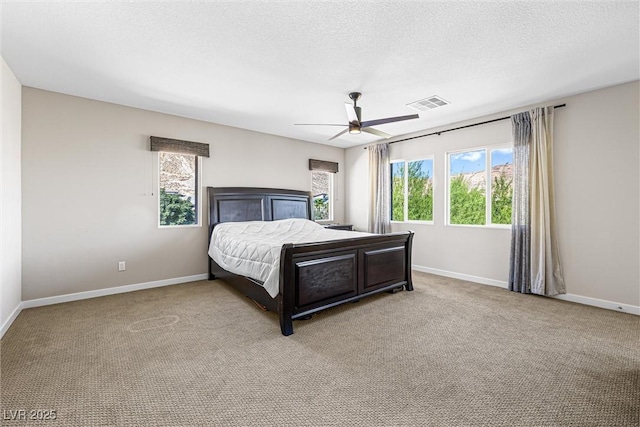 7017 Pearl Hilltop Ct, Las Vegas, NV 89148 - bedroom featuring carpet, a ceiling fan, and a textured ceiling