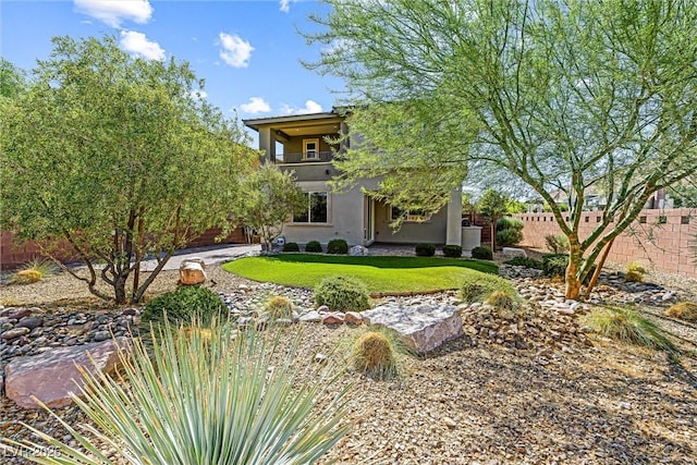 7017 Pearl Hilltop Ct, Las Vegas, NV 89148 - rear view of house with stucco siding and a balcony