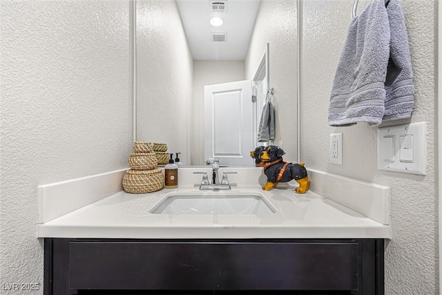 7017 Pearl Hilltop Ct, Las Vegas, NV 89148 - bathroom featuring a textured wall and vanity