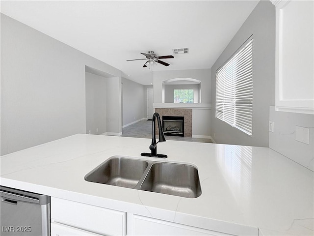3532 Mountain Park St, Las Vegas, NV 89129 - kitchen with a fireplace, dishwasher, white cabinets, ceiling fan, and open floor plan