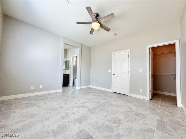 3532 Mountain Park St, Las Vegas, NV 89129 - unfurnished bedroom with a spacious closet, light tile patterned floors, connected bathroom, ceiling fan, and a closet