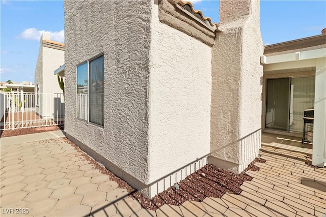 2152 High Dunes Ln, Laughlin, NV 89029 - view of side of property with stucco siding and a patio area