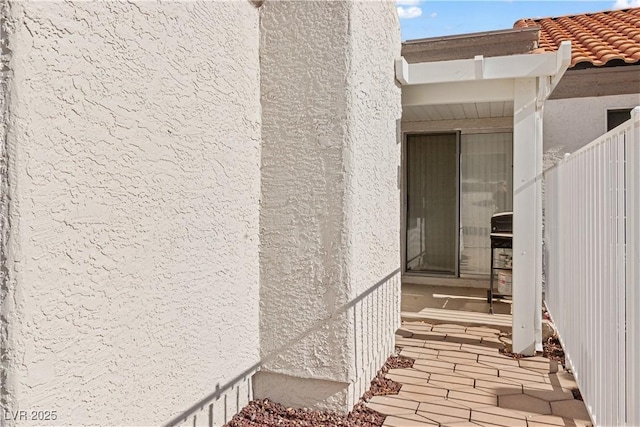 2152 High Dunes Ln, Laughlin, NV 89029 - view of exterior entry with stucco siding and a tiled roof