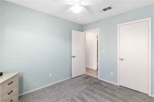 2152 High Dunes Ln, Laughlin, NV 89029 - unfurnished bedroom featuring light colored carpet and a ceiling fan