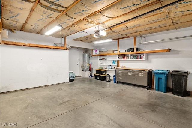 2152 High Dunes Ln, Laughlin, NV 89029 - garage with strapped water heater and a garage door opener