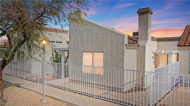 2152 High Dunes Ln, Laughlin, NV 89029 - view of front of property with stucco siding and a chimney