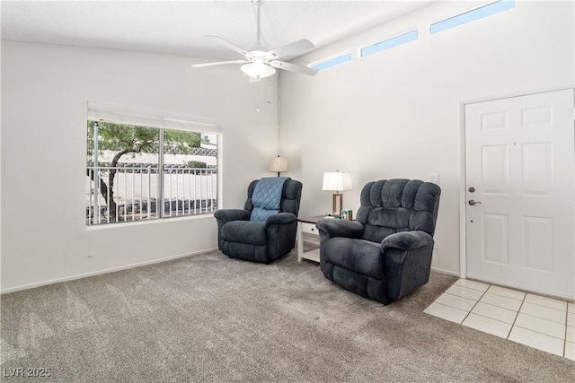 2152 High Dunes Ln, Laughlin, NV 89029 - living area with carpet flooring, ceiling fan, healthy amount of natural light, a high ceiling, and tile patterned flooring