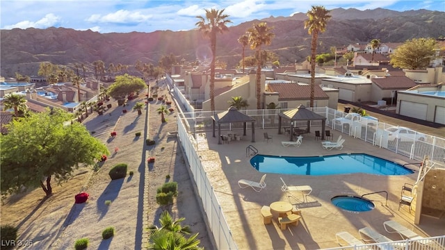 2152 High Dunes Ln, Laughlin, NV 89029 - community pool with a mountain view, a patio area, a community hot tub, and a residential view