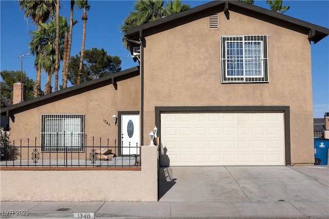 1340 Lucky St, Las Vegas, NV 89104 - view of front of property featuring driveway, stucco siding, and a garage