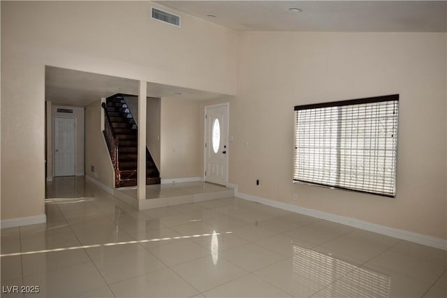 1340 Lucky St, Las Vegas, NV 89104 - tiled entryway featuring stairway, plenty of natural light, and a high ceiling