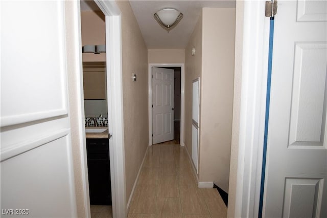 1340 Lucky St, Las Vegas, NV 89104 - hall featuring baseboards and light tile patterned flooring
