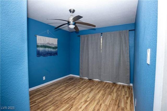 1340 Lucky St, Las Vegas, NV 89104 - unfurnished room with a ceiling fan, wood finished floors, and a textured wall