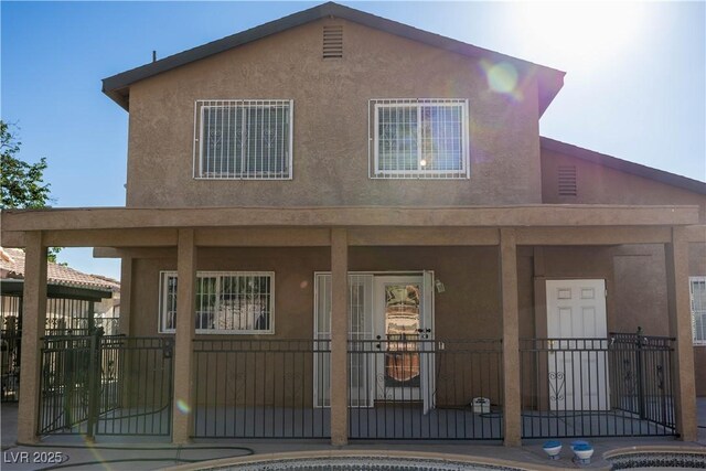 1340 Lucky St, Las Vegas, NV 89104 - view of front of house featuring stucco siding and a porch