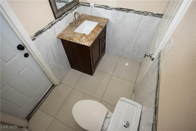 1340 Lucky St, Las Vegas, NV 89104 - bathroom featuring tile walls, vanity, and tile patterned floors