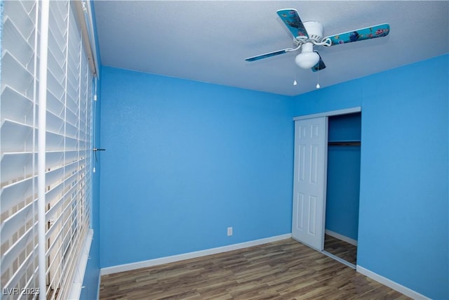 1340 Lucky St, Las Vegas, NV 89104 - unfurnished bedroom with wood finished floors, a closet, and a ceiling fan