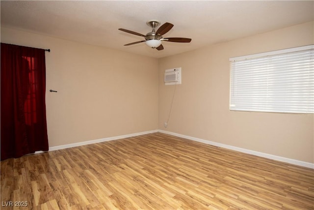 1340 Lucky St, Las Vegas, NV 89104 - empty room with light wood-style floors, ceiling fan, and an AC wall unit