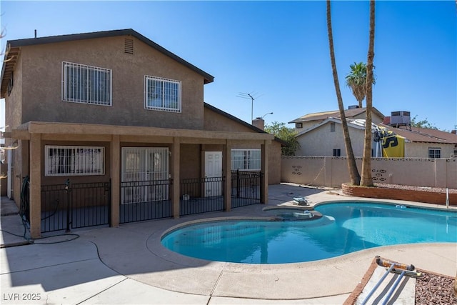 1340 Lucky St, Las Vegas, NV 89104 - view of pool featuring a patio area, a fenced backyard, and a pool with connected hot tub