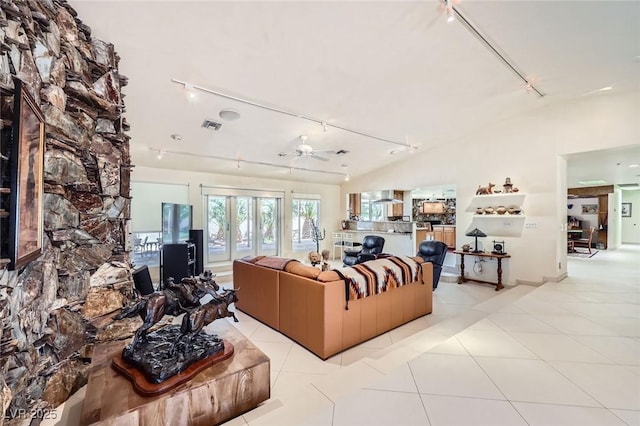 2770 La Casita Ave, Las Vegas, NV 89120 - living area featuring track lighting, a ceiling fan, light tile patterned flooring, and vaulted ceiling