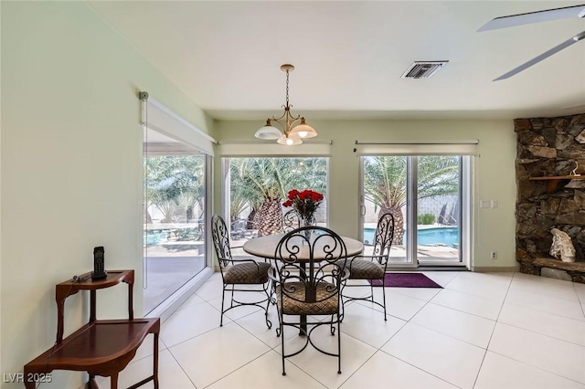 2770 La Casita Ave, Las Vegas, NV 89120 - dining room featuring a chandelier, light tile patterned flooring, and a ceiling fan
