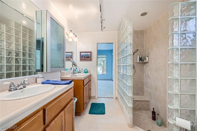 2770 La Casita Ave, Las Vegas, NV 89120 - bathroom with track lighting, walk in shower, tile patterned flooring, and two vanities