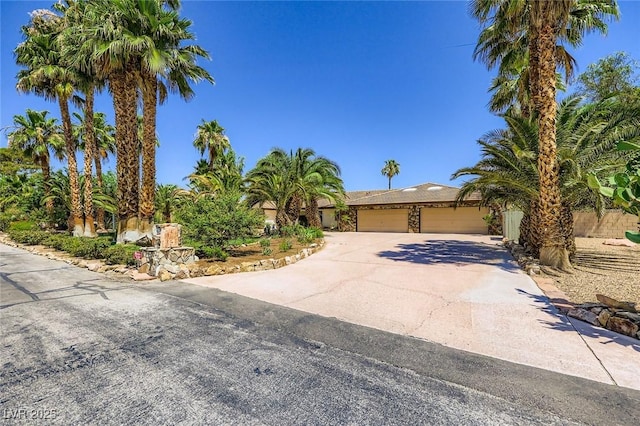 2770 La Casita Ave, Las Vegas, NV 89120 - view of property hidden behind natural elements featuring driveway and an attached garage