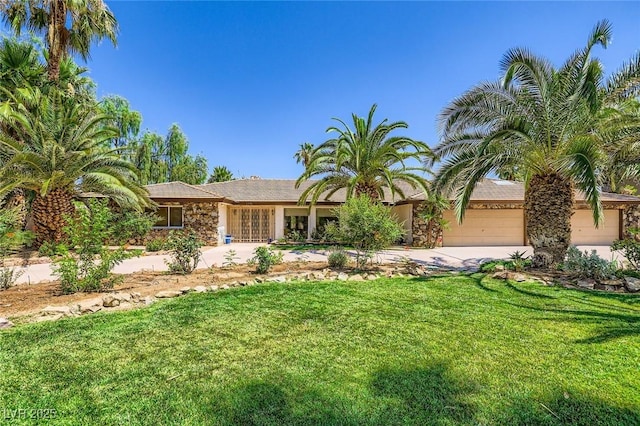 2770 La Casita Ave, Las Vegas, NV 89120 - view of front of home featuring a garage, concrete driveway, and a front lawn