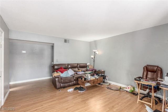5301 River Glen Dr Unit 205, Las Vegas, NV 89103 - living room featuring light wood finished floors and baseboards