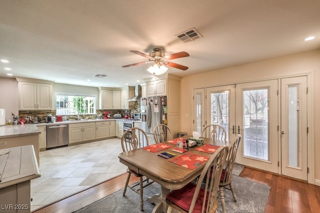 4095 Ridgewood Ave, Las Vegas, NV 89120 - dining room with a ceiling fan, recessed lighting, french doors, and light wood-style floors