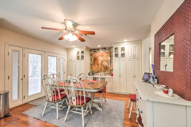 4095 Ridgewood Ave, Las Vegas, NV 89120 - dining area featuring light wood finished floors, ceiling fan, french doors, and recessed lighting