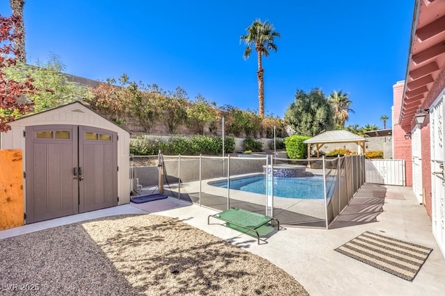 4095 Ridgewood Ave, Las Vegas, NV 89120 - view of swimming pool featuring a shed, a fenced backyard, a patio area, a pool with connected hot tub, and a gazebo