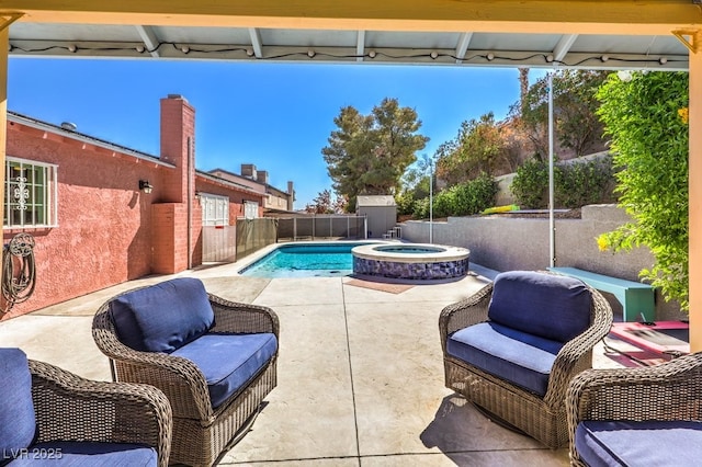 4095 Ridgewood Ave, Las Vegas, NV 89120 - view of pool featuring a patio area, a fenced backyard, and a pool with connected hot tub