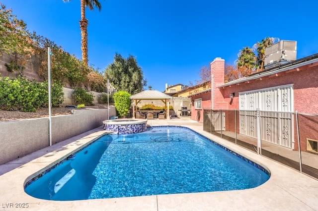 4095 Ridgewood Ave, Las Vegas, NV 89120 - view of swimming pool with a gazebo, mail area, a pool with connected hot tub, and a patio
