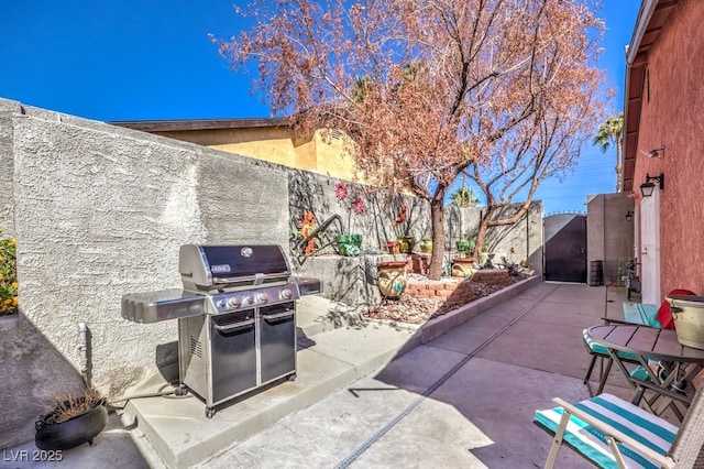 4095 Ridgewood Ave, Las Vegas, NV 89120 - fenced backyard with a grill and a patio area