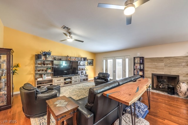 4095 Ridgewood Ave, Las Vegas, NV 89120 - living area with a ceiling fan, wood finished floors, a fireplace, and lofted ceiling