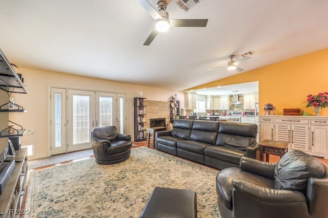 4095 Ridgewood Ave, Las Vegas, NV 89120 - living room with ceiling fan, lofted ceiling, wood finished floors, and a fireplace