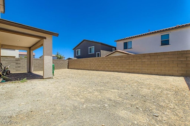 9440 Lunar Ray St, Las Vegas, NV 89143 - fenced backyard with a patio area