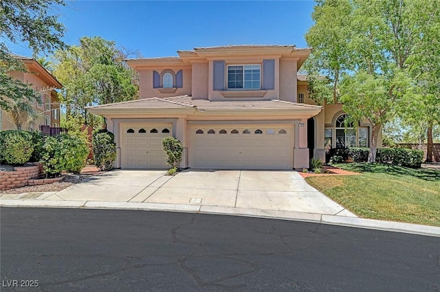 229 N Buteo Woods Ln, Las Vegas, NV 89144 - mediterranean / spanish house featuring an attached garage, stucco siding, a tiled roof, driveway, and a front yard