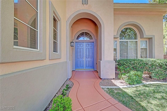 229 N Buteo Woods Ln, Las Vegas, NV 89144 - doorway to property with stucco siding