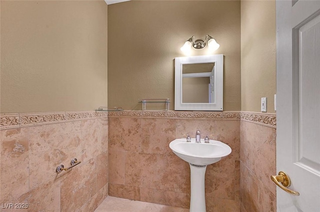 229 N Buteo Woods Ln, Las Vegas, NV 89144 - bathroom featuring a wainscoted wall and tile walls