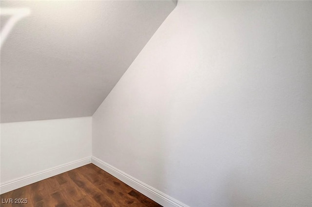 229 N Buteo Woods Ln, Las Vegas, NV 89144 - additional living space featuring lofted ceiling and dark wood-style floors