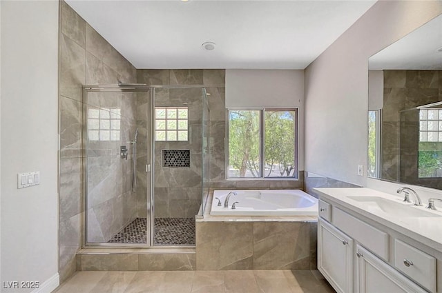 229 N Buteo Woods Ln, Las Vegas, NV 89144 - bathroom featuring a garden tub, vanity, and a stall shower