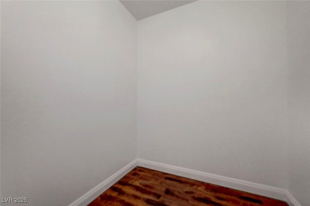 229 N Buteo Woods Ln, Las Vegas, NV 89144 - empty room with wood finished floors and vaulted ceiling