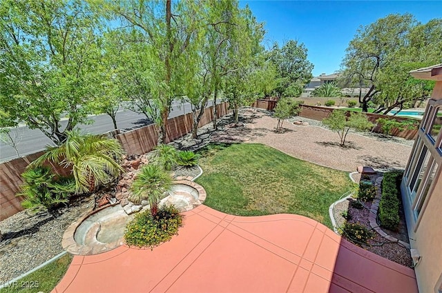 229 N Buteo Woods Ln, Las Vegas, NV 89144 - fenced backyard featuring a patio