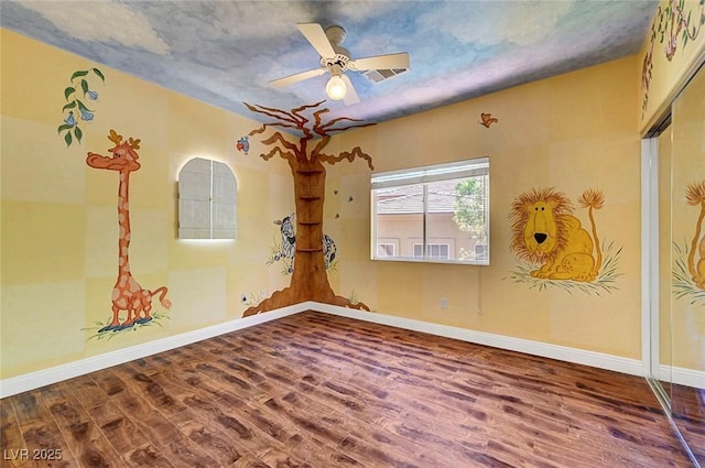 229 N Buteo Woods Ln, Las Vegas, NV 89144 - empty room with wood finished floors and a ceiling fan