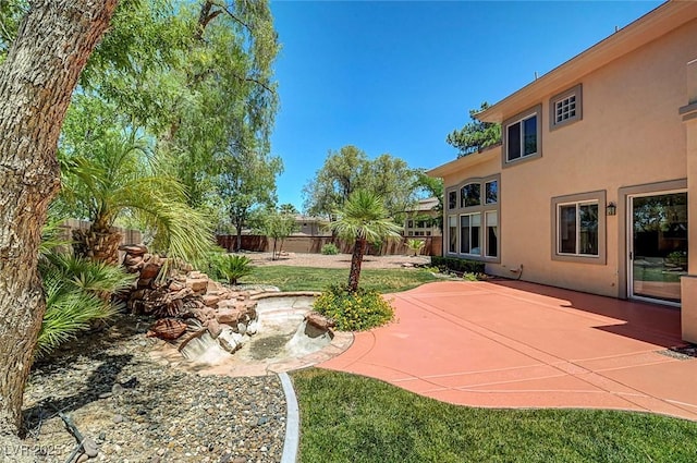 229 N Buteo Woods Ln, Las Vegas, NV 89144 - view of yard with a patio
