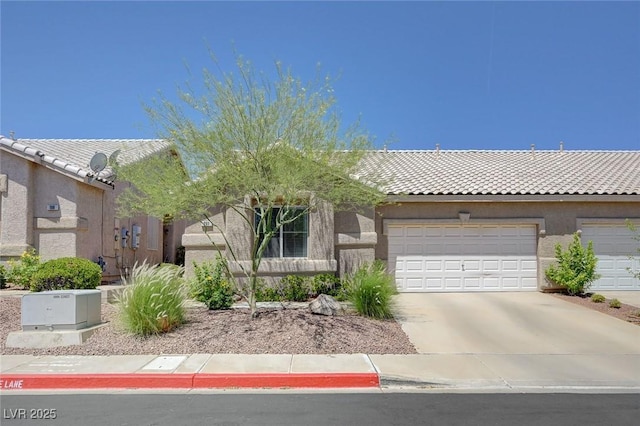 201 Crown Imperial St, Henderson, NV 89074 - view of front of property featuring concrete driveway, a tile roof, an attached garage, and stucco siding